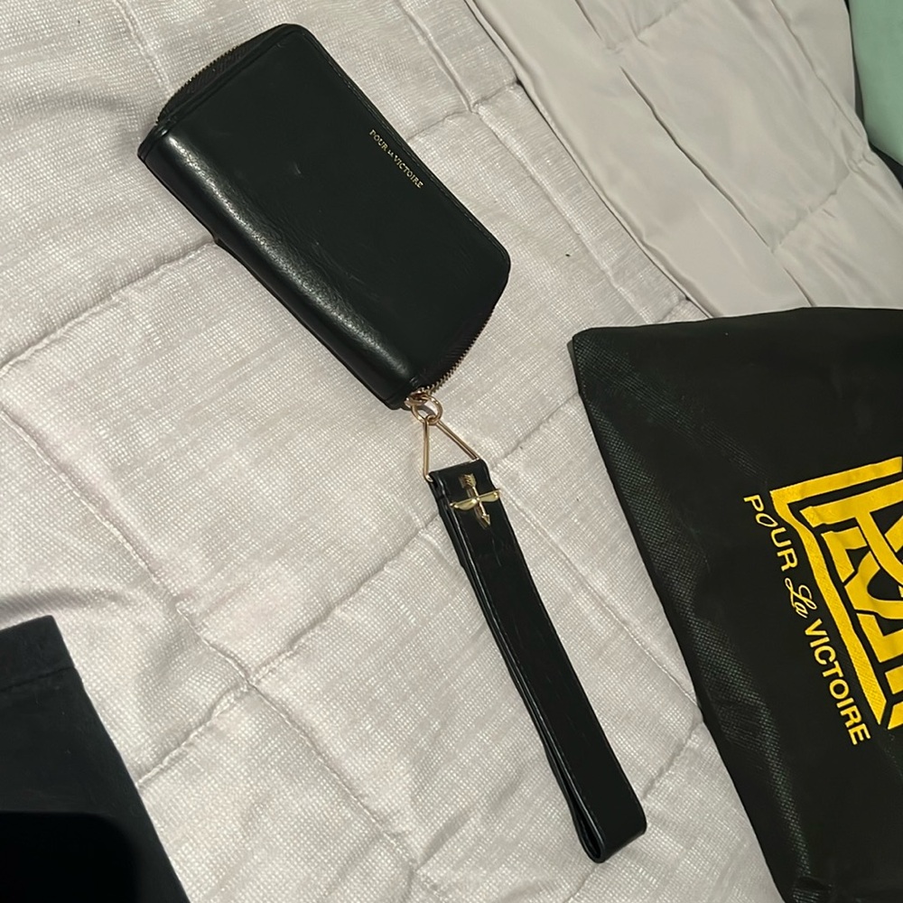 Pour La Victoire black leather clutch wristlet with wrist/hand strap